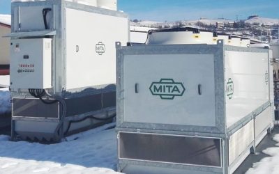 Evaporative condenser and adiabatic gas cooler in a dairy