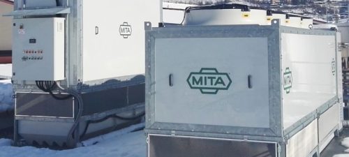 Evaporative condenser and adiabatic gas cooler in a dairy