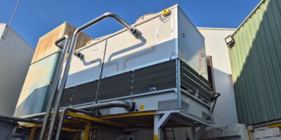 How can a cooling system be adapted when production demand increases?