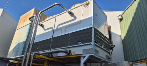 How can a cooling system be adapted when production demand increases?